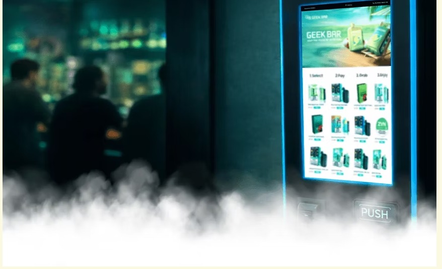 GEEK BAR vape vending machine in a lounge with atmospheric fog